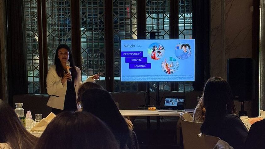 Dr. Fallon Patel presenting to a room of practice owners